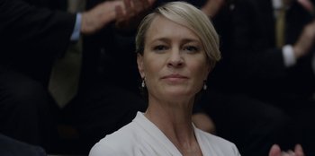 Movie still from “House of Cards” (2013), created by Beau Willimon – A person wearing a white shirt; Close Up shot, Low angle