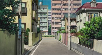 Movie still from “The Secret World of Arrietty” (2010), directed by Hiromasa Yonebayashi – An empty city street with many tall buildings in the background; Extreme Wide shot, High angle