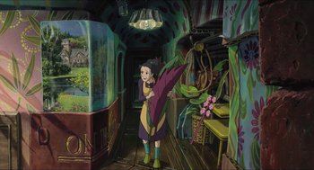 Movie still from “The Secret World of Arrietty” (2010), directed by Hiromasa Yonebayashi – A painting of a girl holding a large flower; Wide shot, High angle