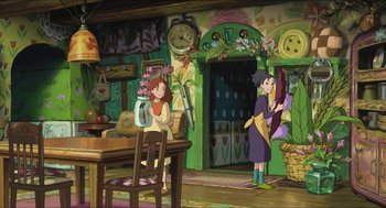 Movie still from “The Secret World of Arrietty” (2010), directed by Hiromasa Yonebayashi – Two people are sitting at a table in a room; Wide shot, High angle