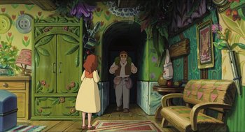 Movie still from “The Secret World of Arrietty” (2010), directed by Hiromasa Yonebayashi – An animated scene of a woman and a man in a doorway; Wide shot, Over the shoulder angle