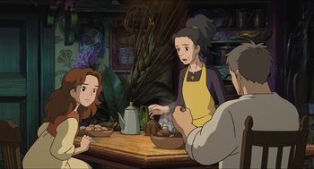 Movie still from “The Secret World of Arrietty” (2010), directed by Hiromasa Yonebayashi – A group of people sitting around a table; Medium shot, High angle