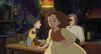 Movie still from “The Secret World of Arrietty” (2010), directed by Hiromasa Yonebayashi – A woman standing in front of a table with other people; Medium shot, Over the shoulder angle