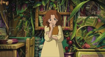 Movie still from “The Secret World of Arrietty” (2010), directed by Hiromasa Yonebayashi – A woman standing next to a bookshelf in front of a book case; Medium shot, High angle