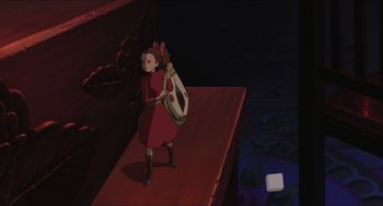 Movie still from “The Secret World of Arrietty” (2010), directed by Hiromasa Yonebayashi – A cartoon of a woman holding a guitar; Wide shot, High angle