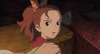Movie still from “The Secret World of Arrietty” (2010), directed by Hiromasa Yonebayashi – A young girl is looking into the distance; Close Up shot, High angle