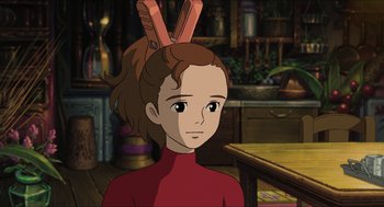 Movie still from “The Secret World of Arrietty” (2010), directed by Hiromasa Yonebayashi – A girl with two hair clips on her head; Close Up shot, Over the shoulder angle