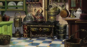 Movie still from “The Secret World of Arrietty” (2010), directed by Hiromasa Yonebayashi – An old - fashioned kitchen with pots , pans , and a stove; Wide shot, High angle