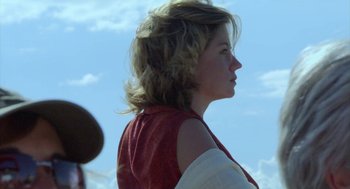 Movie still from “The Secret of the Grain” (2007), directed by Abdellatif Kechiche – A young woman is standing in the sunlight; Close Up shot, Low angle