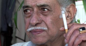 Movie still from “The Secret of the Grain” (2007), directed by Abdellatif Kechiche – An older man with a cigarette in his mouth; Extreme Close Up shot, Low angle