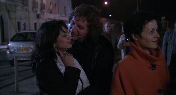 Movie still from “The Secret of the Grain” (2007), directed by Abdellatif Kechiche – A man and a woman kissing each other on the cheek; Close Up shot, Over the shoulder angle