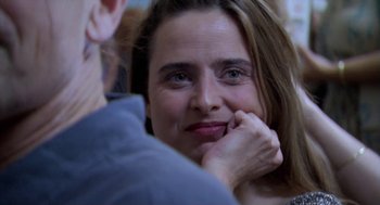 Movie still from “The Secret of the Grain” (2007), directed by Abdellatif Kechiche – A person with her hand on her face; Close Up shot, Over the shoulder angle