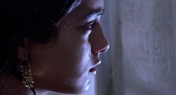 Movie still from “The Secret of the Grain” (2007), directed by Abdellatif Kechiche – A person's face with water droplets on them; Extreme Close Up shot, Low angle