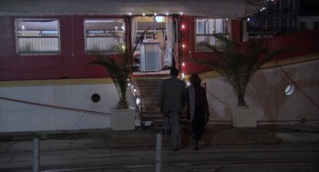Movie still from “The Secret of the Grain” (2007), directed by Abdellatif Kechiche – A man and a woman walking down the steps of a train; Extreme Wide shot, High angle