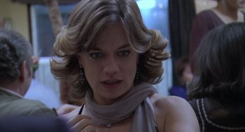 Movie still from “The Secret of the Grain” (2007), directed by Abdellatif Kechiche – A person wearing a scarf; Close Up shot, Over the shoulder angle