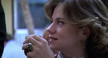 Movie still from “The Secret of the Grain” (2007), directed by Abdellatif Kechiche – A person wearing a ring on her finger; Close Up shot, Over the shoulder angle