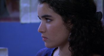 Movie still from “The Secret of the Grain” (2007), directed by Abdellatif Kechiche – A person looking to the side; Close Up shot, Over the shoulder angle