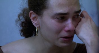 Movie still from “The Secret of the Grain” (2007), directed by Abdellatif Kechiche – A person with a crying face; Close Up shot, High angle