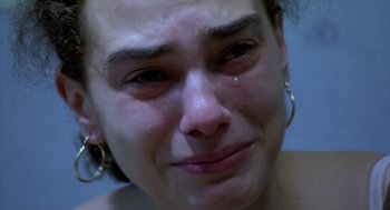 Movie still from “The Secret of the Grain” (2007), directed by Abdellatif Kechiche – A person with a tear in her eye; Close Up shot, High angle