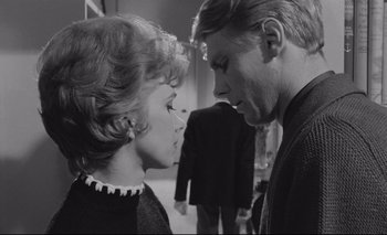 Movie still from “The Servant” (1963), directed by Joseph Losey – A man and a woman face to face in black and white; Close Up shot, Low angle