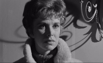 Movie still from “The Servant” (1963), directed by Joseph Losey – Black and white photograph of a woman in a fur coat; Close Up shot, Low angle