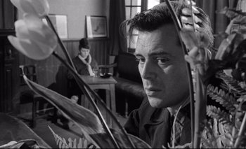 Movie still from “The Servant” (1963), directed by Joseph Losey – A black and white photo of a man and a woman; Close Up shot, Low angle