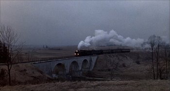 Movie still from “The Seven-Per-Cent Solution” (1976), directed by Herbert Ross – A train is going over a bridge in the middle of the night; Extreme Wide shot, High angle