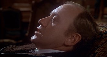 Movie still from “The Seven-Per-Cent Solution” (1976), directed by Herbert Ross – A person laying down with his eyes closed; Close Up shot, High angle