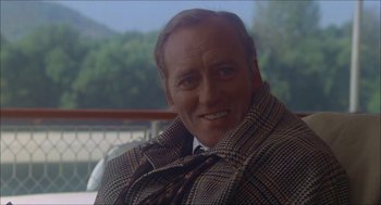 Movie still from “The Seven-Per-Cent Solution” (1976), directed by Herbert Ross – A person wearing a suit and tie; Close Up shot, Over the shoulder angle