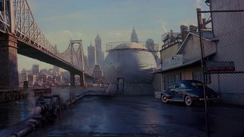 Movie still from “The Shadow” (1994), directed by Russell Mulcahy – An image of an old car parked in a parking lot; Extreme Wide shot, High angle
