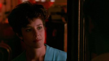 Movie still from “The Sheltering Sky” (1990), directed by Bernardo Bertolucci – A person with short hair; Close Up shot, Over the shoulder angle