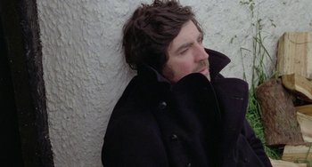 Movie still from “The Shout” (1978), directed by Jerzy Skolimowski – A person leaning against a wall; Close Up shot, High angle