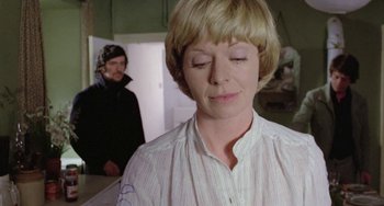 Movie still from “The Shout” (1978), directed by Jerzy Skolimowski – A woman with her eyes closed in front of another woman; Close Up shot, Over the shoulder angle