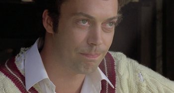 Movie still from “The Shout” (1978), directed by Jerzy Skolimowski – A person wearing a tie; Close Up shot, Low angle