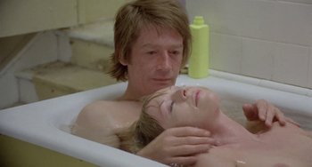 Movie still from “The Shout” (1978), directed by Jerzy Skolimowski – A man and a woman in a bath tub; Close Up shot, High angle