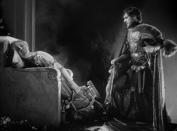Movie still from “The Sign of the Cross” (1932), directed by Cecil B. DeMille – A man and a woman dressed in medieval garb; Wide shot, High angle