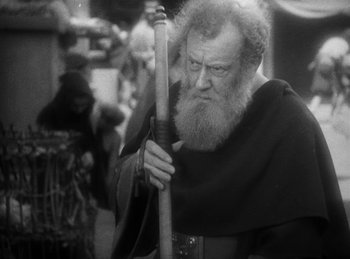 Movie still from “The Sign of the Cross” (1932), directed by Cecil B. DeMille – An old man with a long beard holding a stick; Close Up shot, Low angle