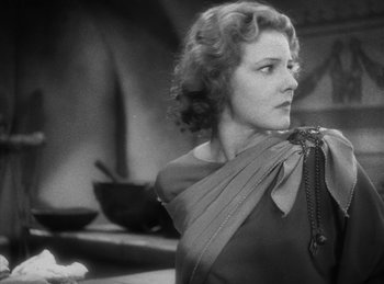 Movie still from “The Sign of the Cross” (1932), directed by Cecil B. DeMille – An old photo of a woman in a black dress; Close Up shot, Low angle