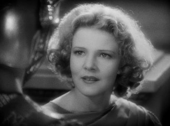 Movie still from “The Sign of the Cross” (1932), directed by Cecil B. DeMille – A black - and - white photo of a woman with curly hair; Close Up shot, Over the shoulder angle