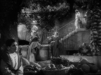 Movie still from “The Sign of the Cross” (1932), directed by Cecil B. DeMille – A black and white photo of people at a market; Extreme Wide shot, High angle