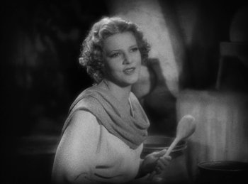 Movie still from “The Sign of the Cross” (1932), directed by Cecil B. DeMille – An old photo of a woman holding a wooden spoon; Close Up shot, Low angle