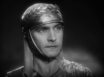 Movie still from “The Sign of the Cross” (1932), directed by Cecil B. DeMille – A person wearing a helmet; Close Up shot, High angle