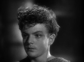 Movie still from “The Sign of the Cross” (1932), directed by Cecil B. DeMille – A young man with curly hair is looking at the camera; Close Up shot, High angle