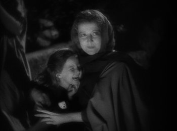 Movie still from “The Sign of the Cross” (1932), directed by Cecil B. DeMille – A woman and a child are standing next to each other; Close Up shot, Over the shoulder angle