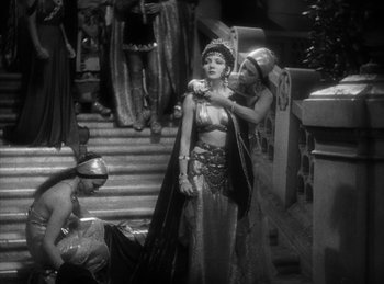 Movie still from “The Sign of the Cross” (1932), directed by Cecil B. DeMille – A woman in a costume standing next to another woman; Wide shot, High angle