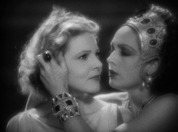 Movie still from “The Sign of the Cross” (1932), directed by Cecil B. DeMille – Two women are embracing each other in a black - and - white photo; Close Up shot, Low angle