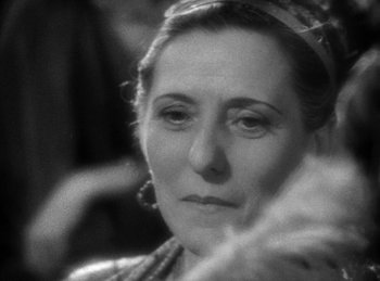 Movie still from “The Sign of the Cross” (1932), directed by Cecil B. DeMille – An older woman is looking at the camera; Close Up shot, Over the shoulder angle