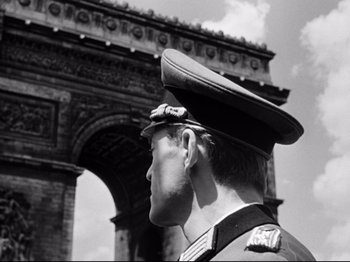 Movie still from “The Silence of the Sea” (1949), directed by Jean-Pierre Melville – A black and white photo of a man in a military uniform; Close Up shot, Low angle
