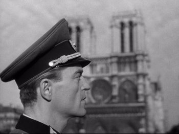Movie still from “The Silence of the Sea” (1949), directed by Jean-Pierre Melville – A black and white photo of a man in a military uniform; Close Up shot, Low angle