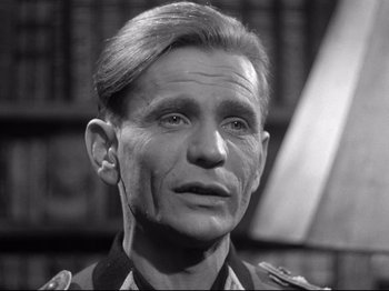 Movie still from “The Silence of the Sea” (1949), directed by Jean-Pierre Melville – An older man wearing a military uniform and looking to his left; Close Up shot, Low angle